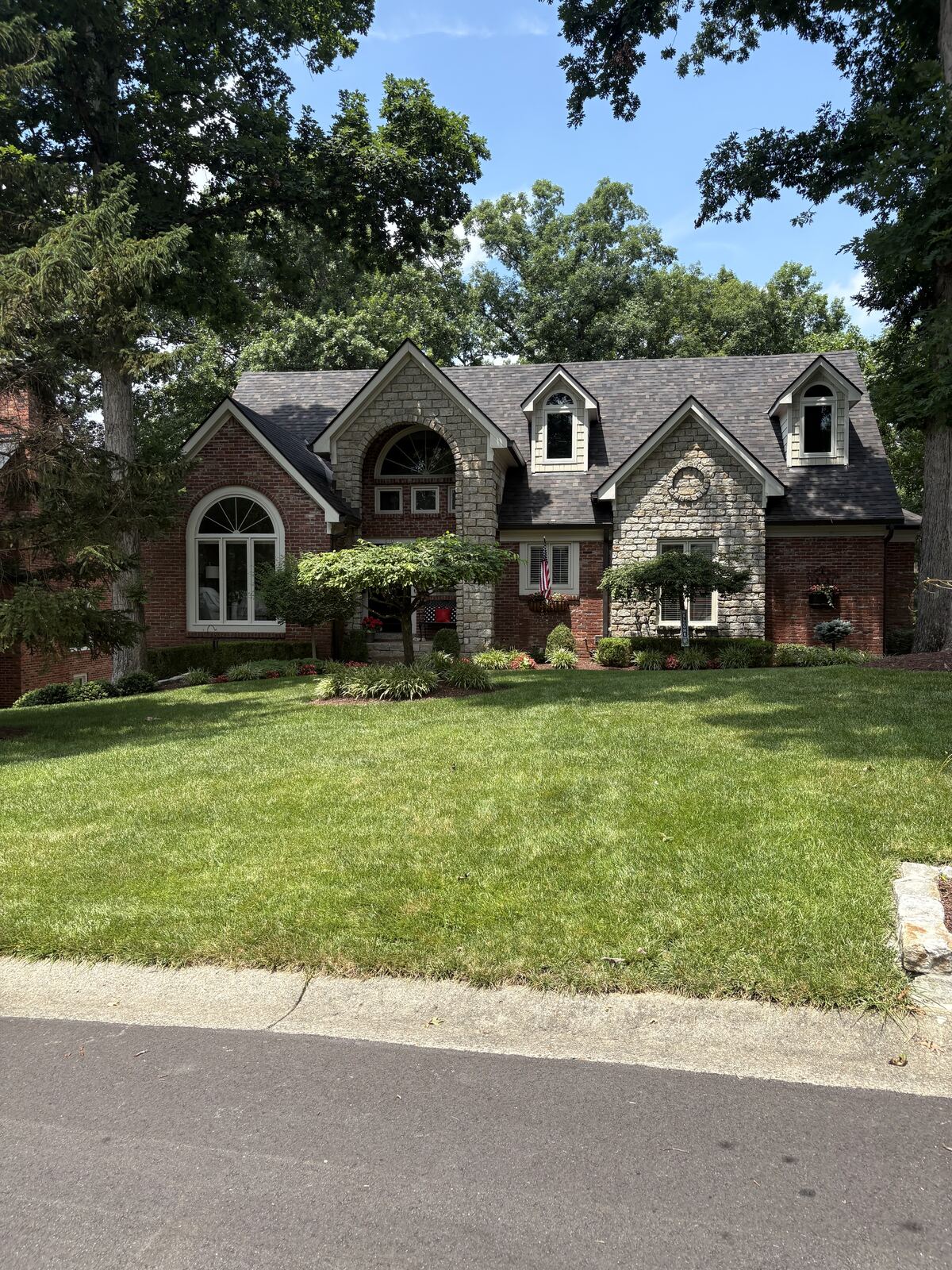 Stone and brick home exterior after cleaning